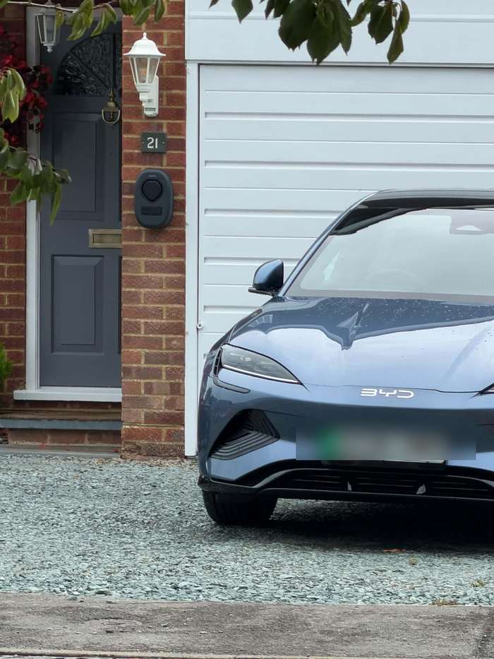 Home EV charger installed on a driveway by ElectriciansNearYou