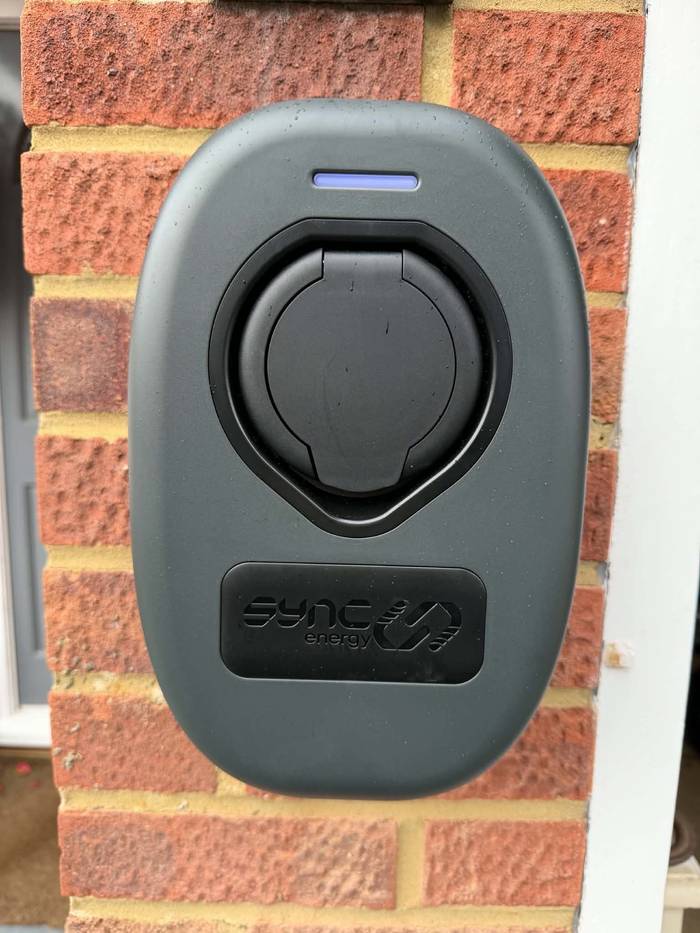 Close-up of a wall-mounted home EV charger