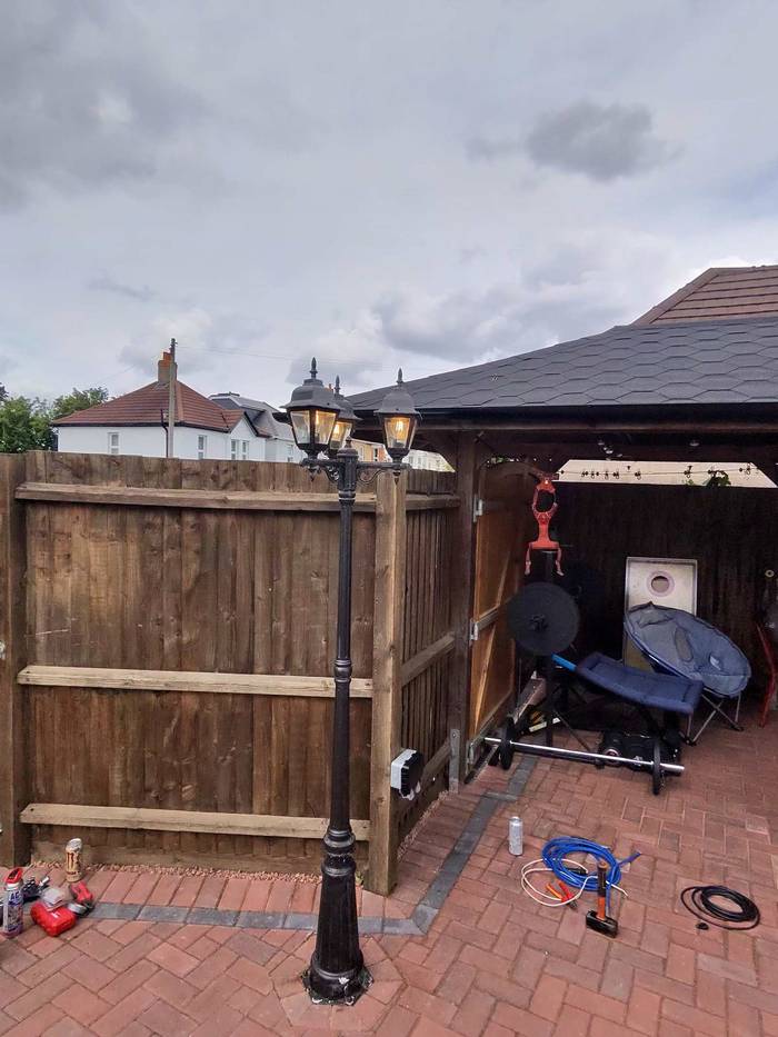 Outdoor lamp post installed in a garden