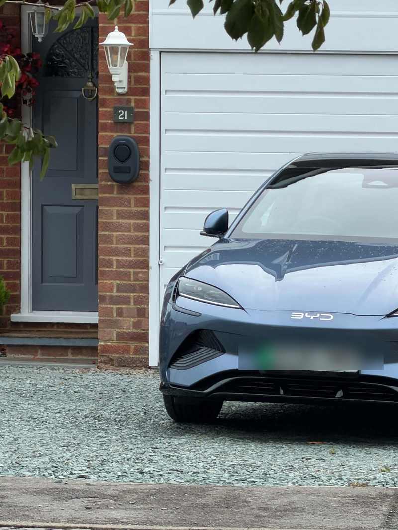 Home EV charger installed on a driveway by ElectriciansNearYou