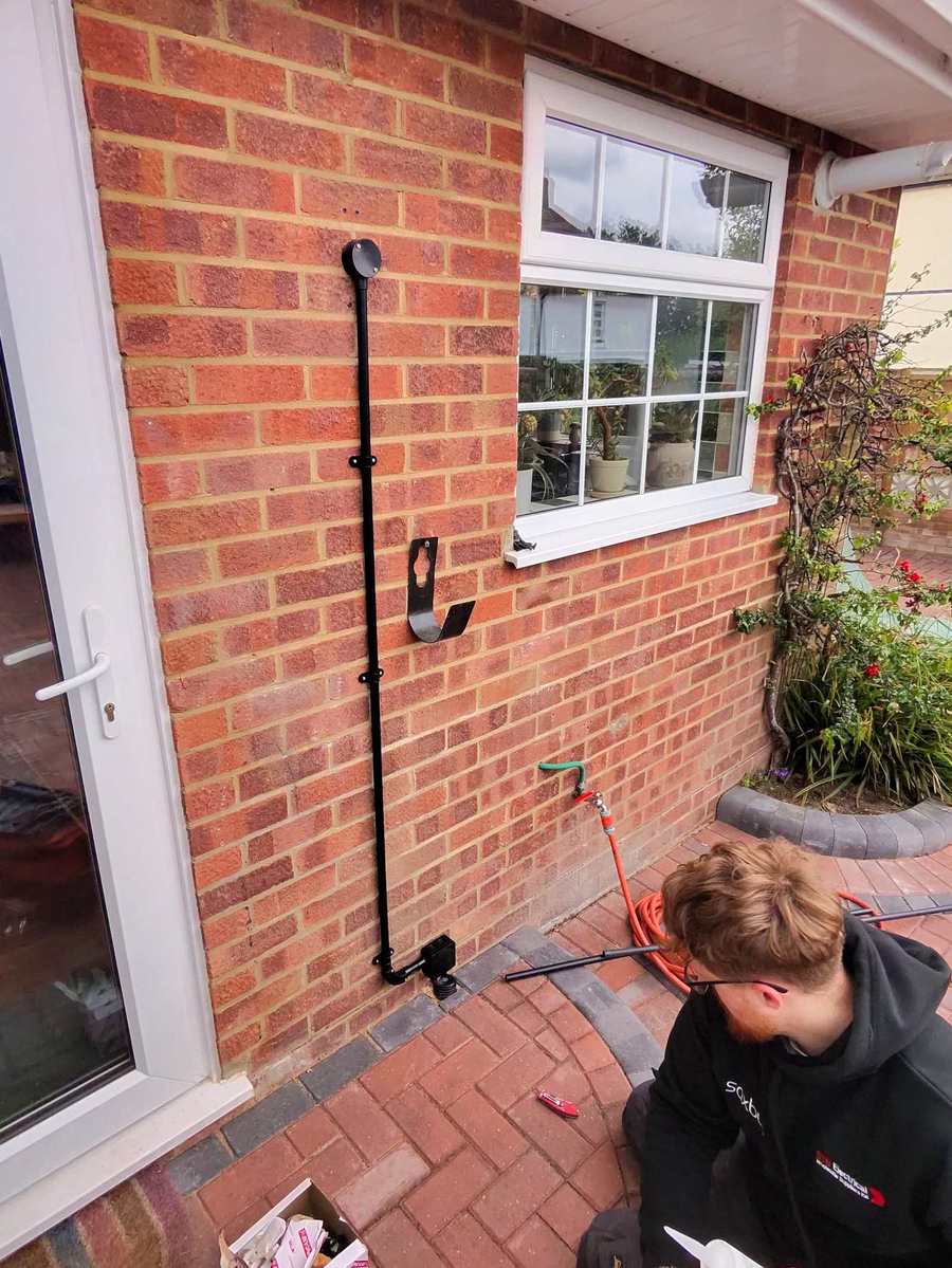 Electrician completing an outdoor accessory installation for ElectriciansNearYou